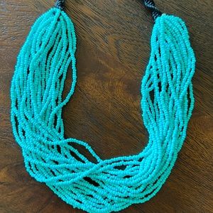 Plastic turquoise beaded necklace.